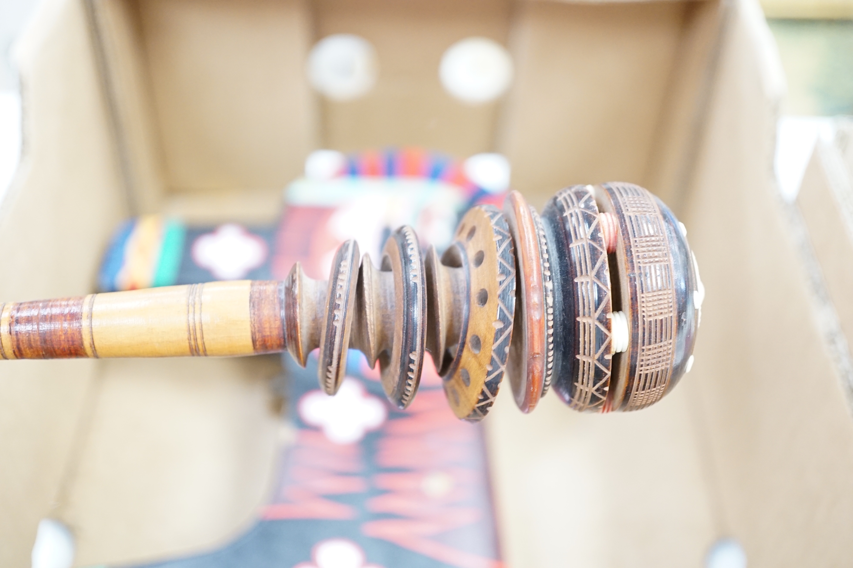 Two Aboriginal boomerangs, an African mask, a painted lion figure and four other items (8)